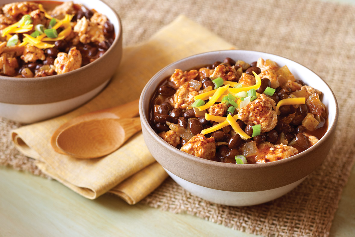 A picture of Black Bean Turkey Chili served in a white bowl.